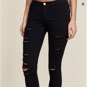 Frame black distressed skinny jeans